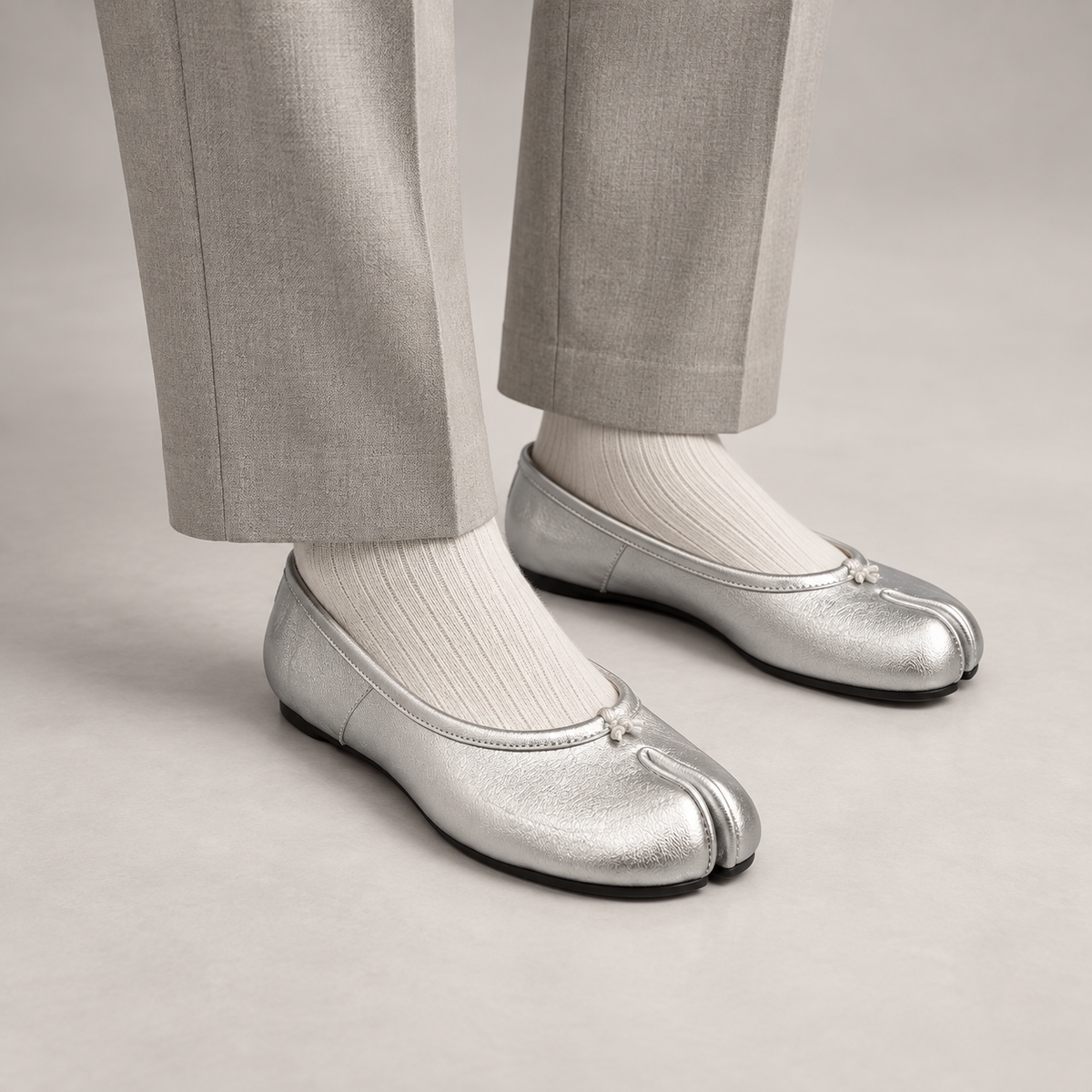 Silver Leather Split-Toe Bow Ballet Flats worn on foot