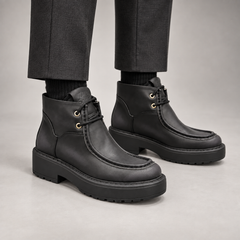 Black Leather Platform Moc-Toe Ankle Boots worn on foot