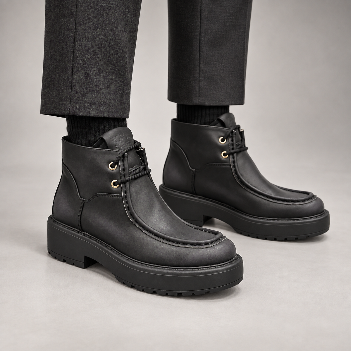 Black Leather Platform Moc-Toe Ankle Boots worn on foot