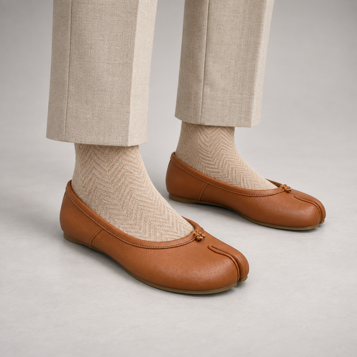 Tan Leather Split-Toe Bow Ballet Flats worn on foot
