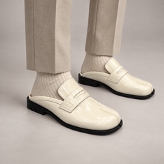 White Patent Leather Split-Toe Penny Strap Mules worn on foot