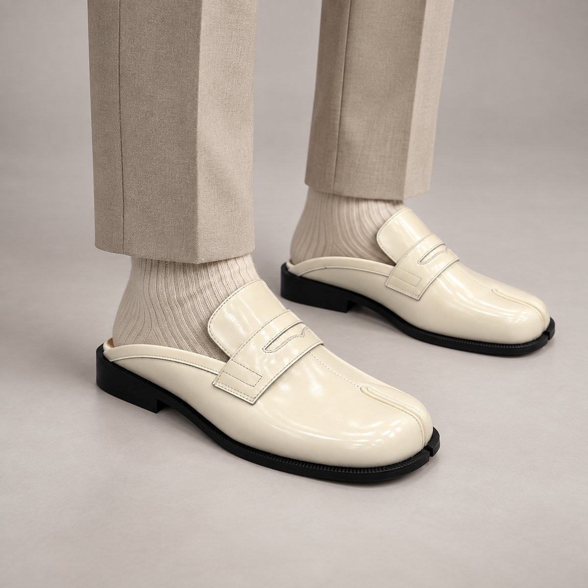White Patent Leather Split-Toe Penny Strap Mules worn on foot