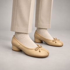 Beige Leather Split-Toe Bow Block-Heel Flats worn on foot