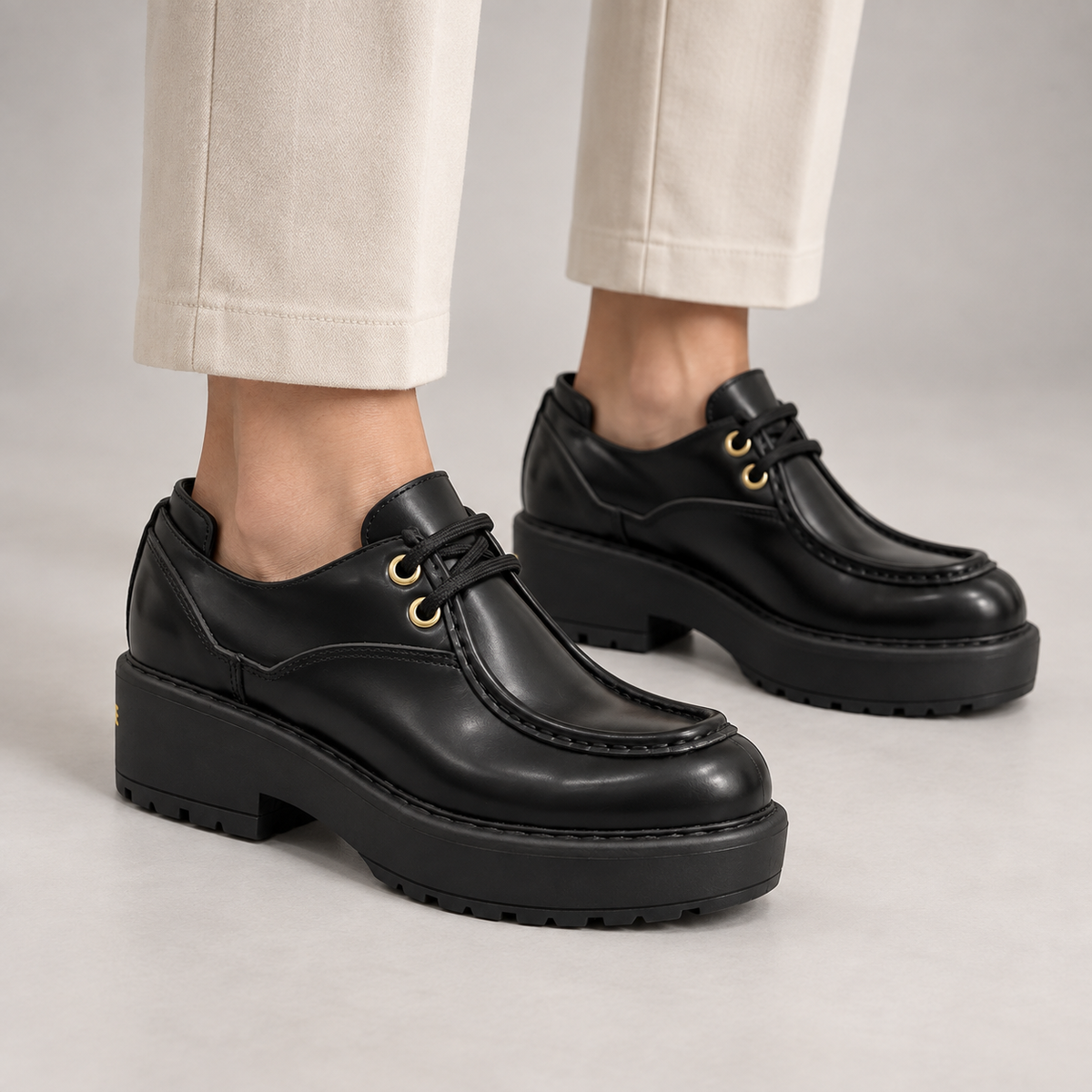 Black Polished Leather Platform Moc-Toe Lace-Up Shoes worn on foot