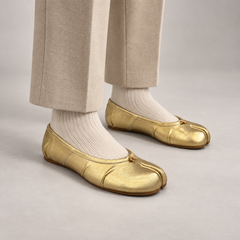 Gold Leather Split-Toe Bow Ballet Flats worn on foot