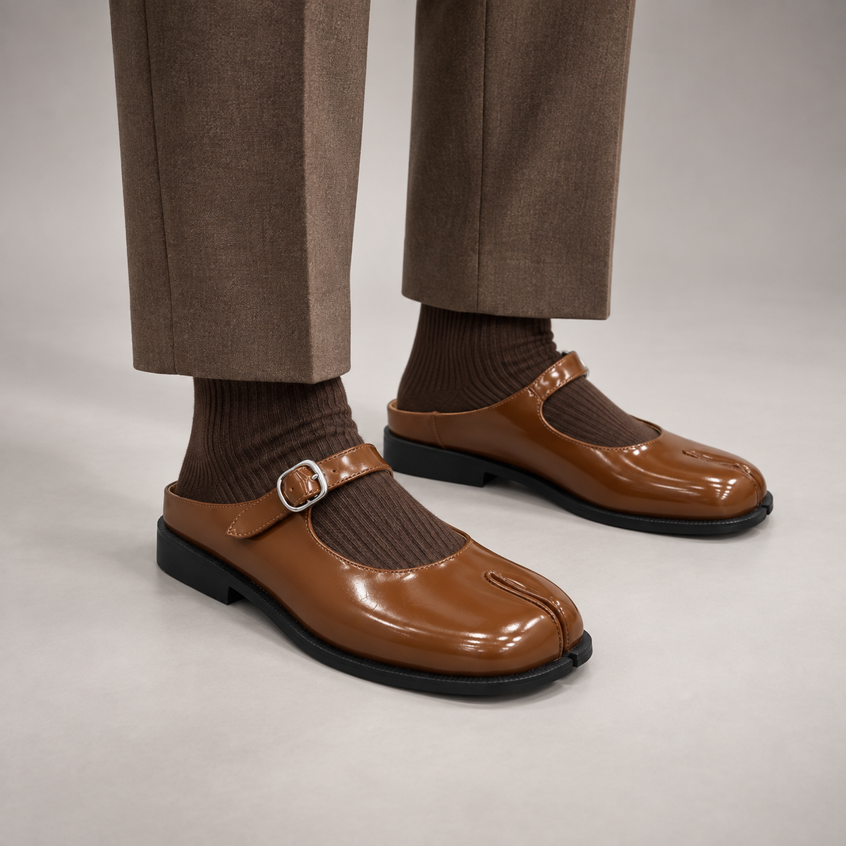 Brown Patent Leather Split-Toe Mary Jane Mules worn on foot