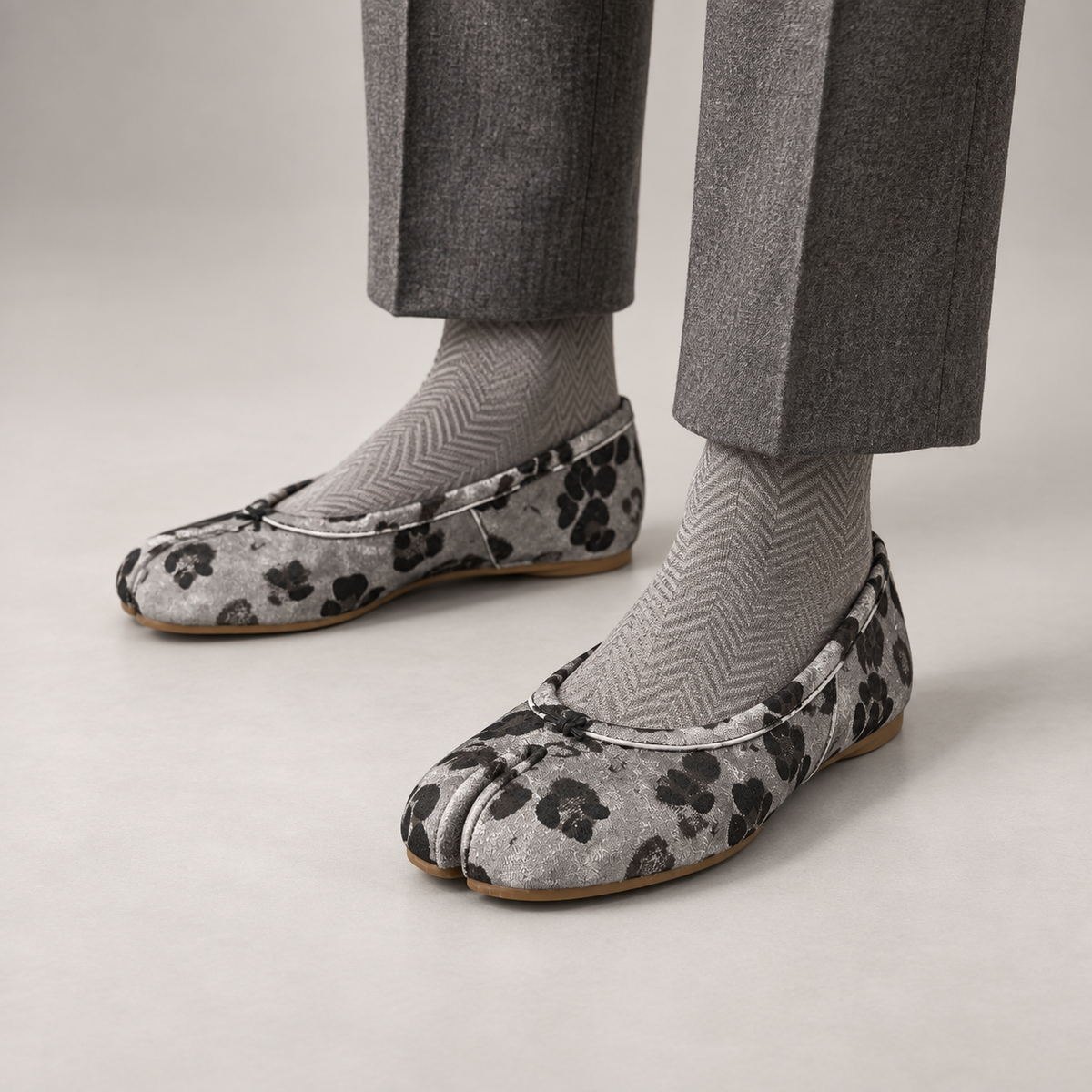 Gray and Black Animal-Print Split-Toe Ballet Flats worn on foot