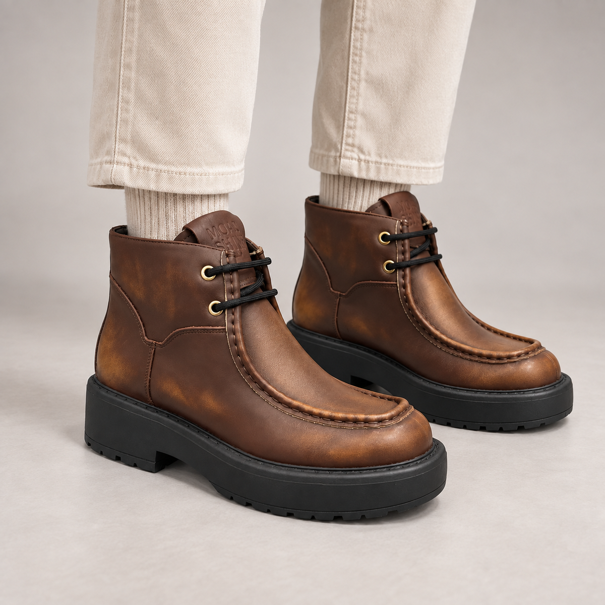 Brown Leather Platform Moc-Toe Ankle Boots worn on foot
