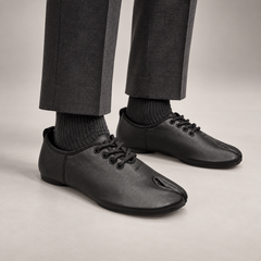 Black Leather Split-Toe Lace-Up Flats worn on foot