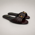 Brown slide sandal pair three-quarter view showing a pleated forefoot strap