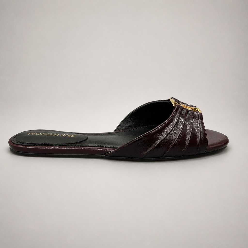 Brown slide sandal side profile showing a pleated forefoot strap