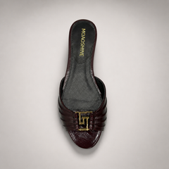 Brown slide sandal top view showing a pleated forefoot strap