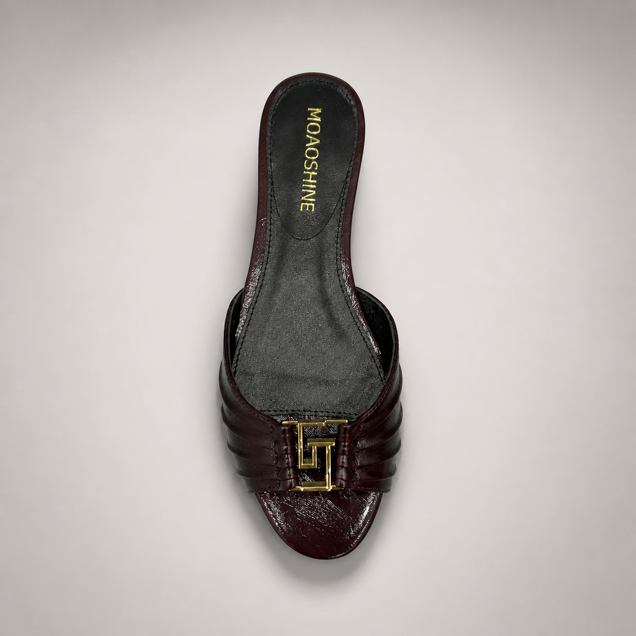 Brown slide sandal top view showing a pleated forefoot strap