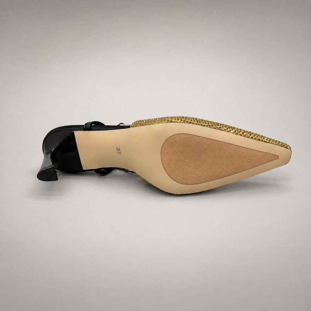 Gold slingback pump outsole view showing the cow leather outsole