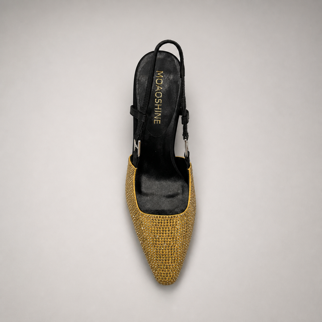 Gold slingback pump top view showing a pointed toe and double slingback straps