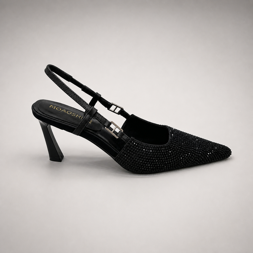 Black slingback pump side profile showing a pointed toe and double slingback straps