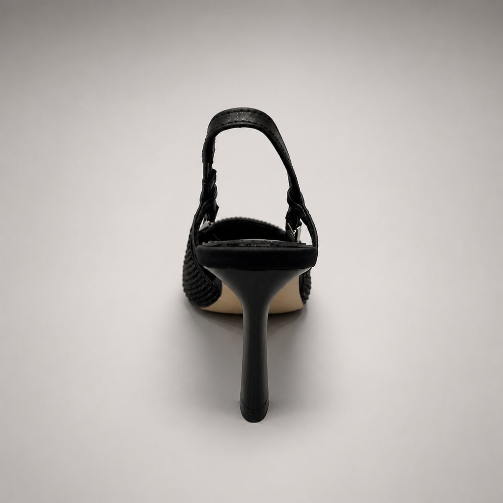 Black slingback pump rear view showing a pointed toe and double slingback straps