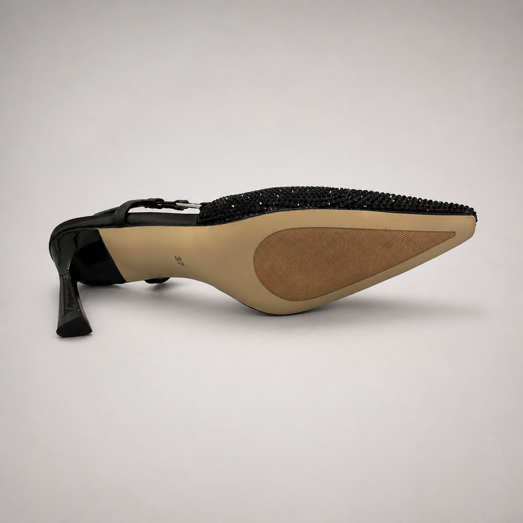 Black slingback pump outsole view showing the cow leather outsole
