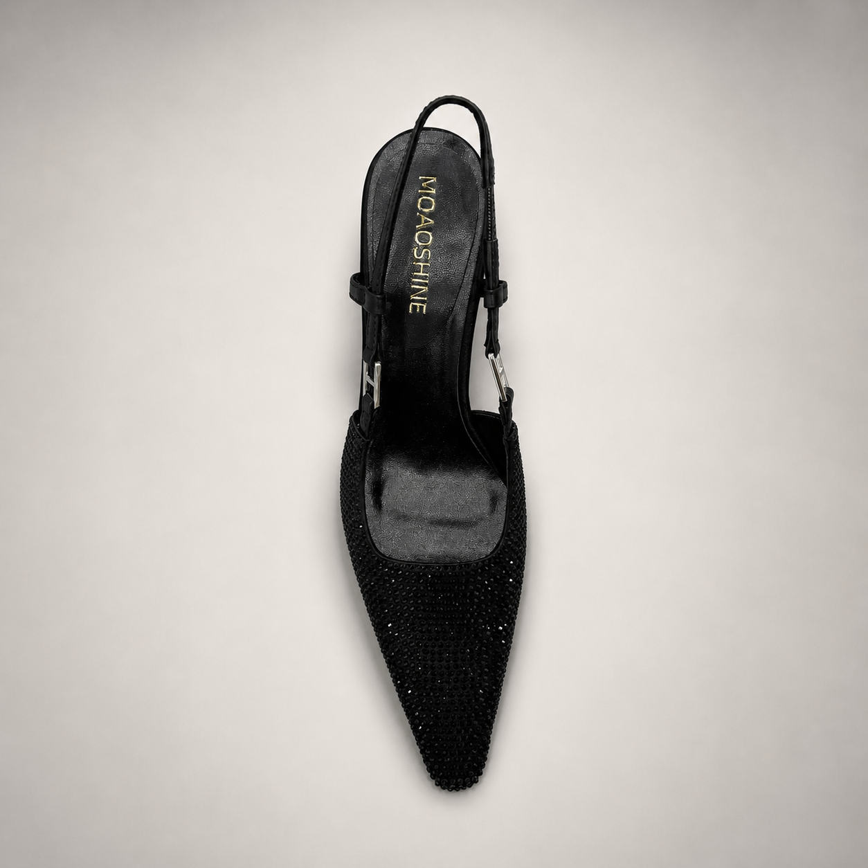 Black slingback pump top view showing a pointed toe and double slingback straps