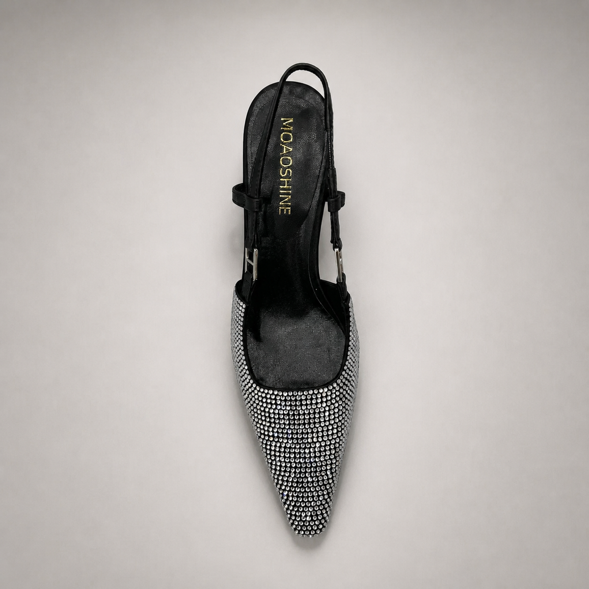 Gray slingback pump top view showing a pointed toe and double slingback straps