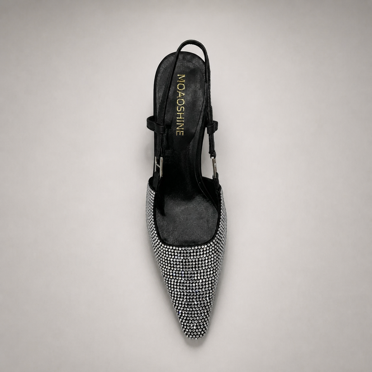 Gray slingback pump top view showing a pointed toe and double slingback straps