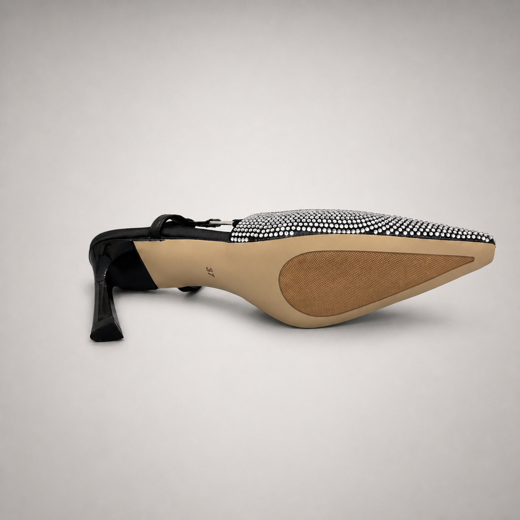 Gray slingback pump outsole view showing the cow leather outsole