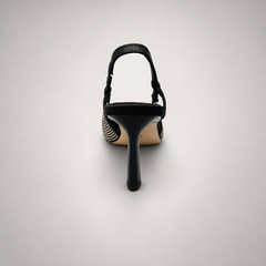 Gray slingback pump rear view showing a pointed toe and double slingback straps