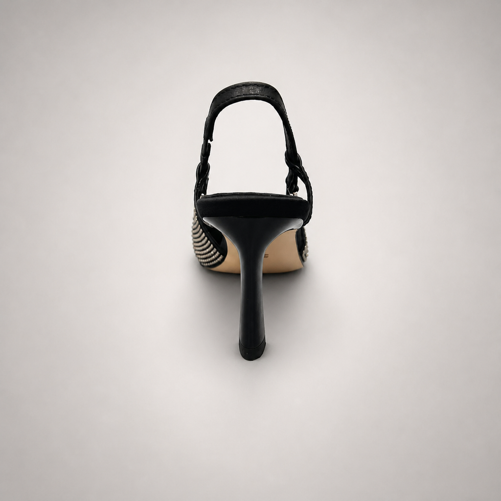 Gray slingback pump rear view showing a pointed toe and double slingback straps