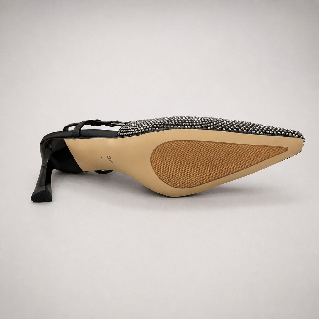 Gray slingback pump top view showing a pointed toe and double slingback straps