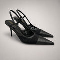 Black slingback pump pair three-quarter view showing a pointed toe and lace-panel upper