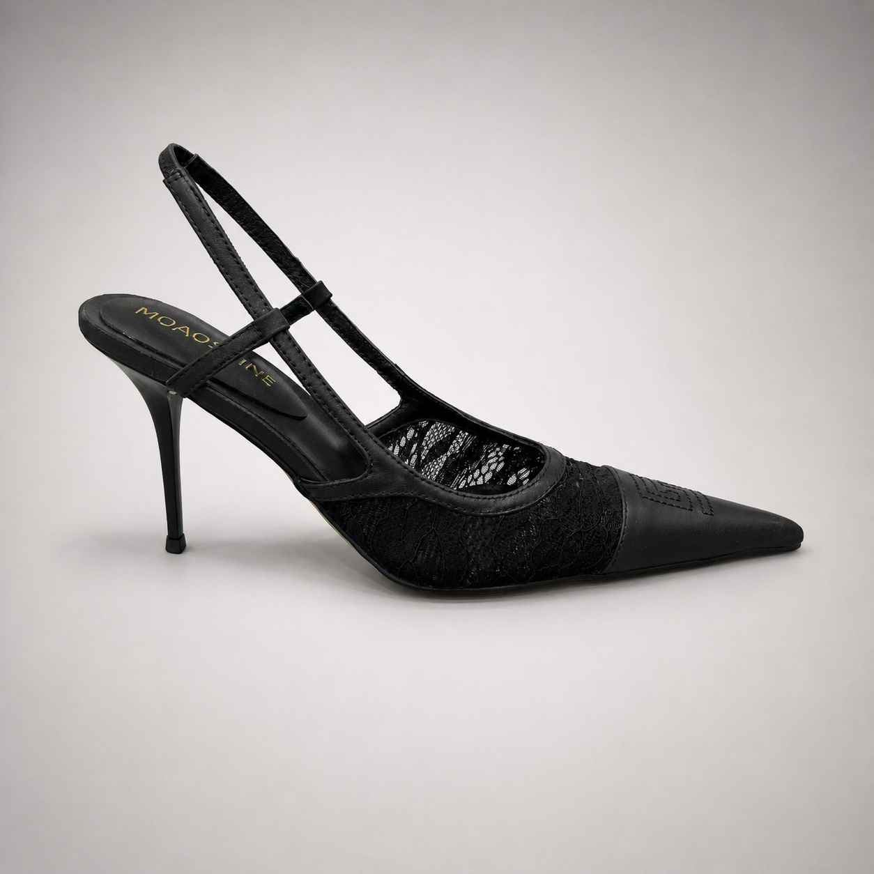 Black slingback pump side profile showing a pointed toe and lace-panel upper