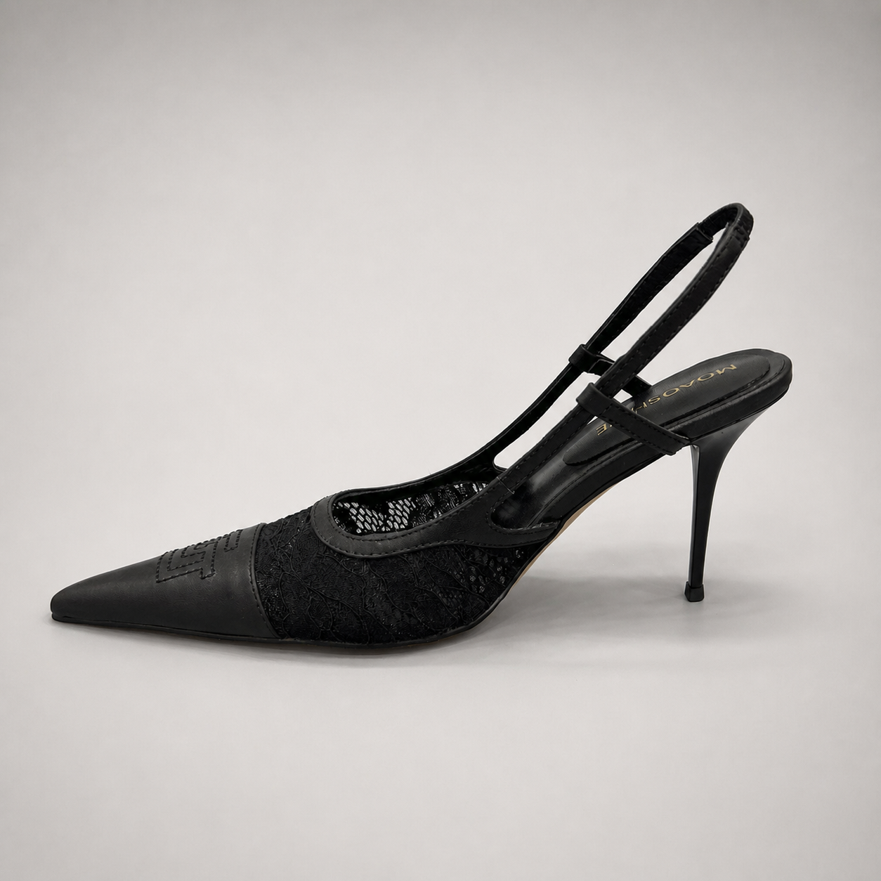 Black slingback pump opposite side profile showing a pointed toe and lace-panel upper