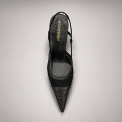 Black slingback pump outsole view showing the cow leather outsole