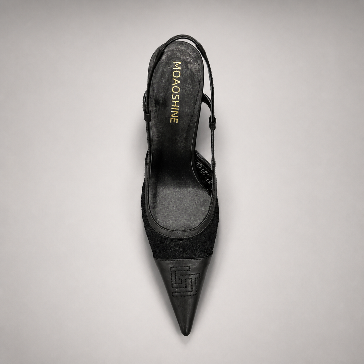Black slingback pump outsole view showing the cow leather outsole