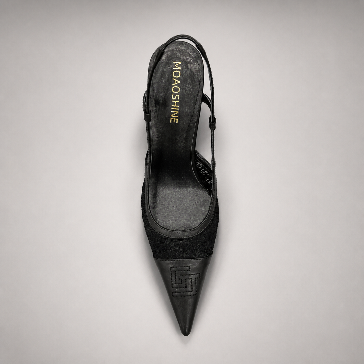 Black slingback pump outsole view showing the cow leather outsole