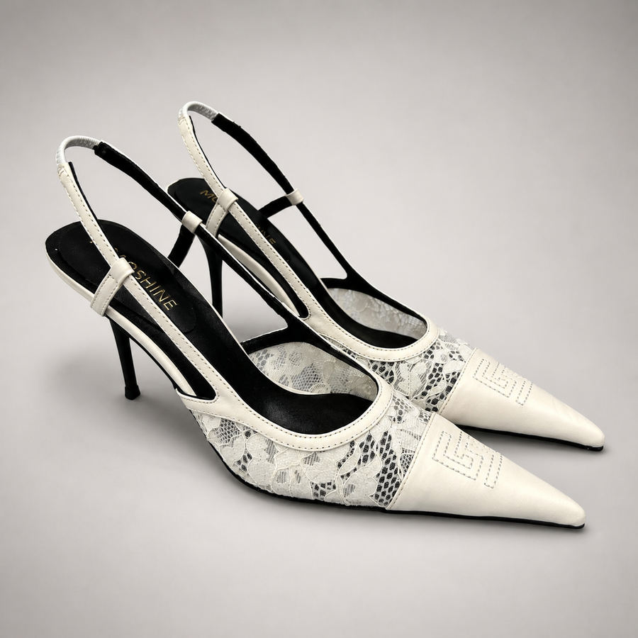 White slingback pump pair three-quarter view showing a pointed toe and lace-panel upper