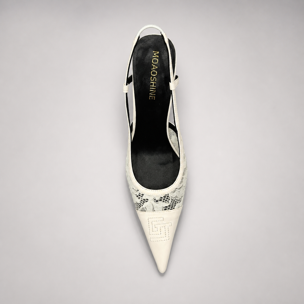 White slingback pump rear view showing a pointed toe and lace-panel upper