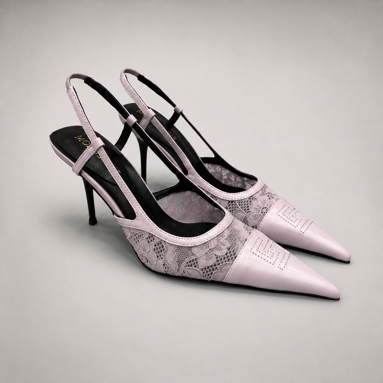Pink slingback pump pair three-quarter view showing a pointed toe and lace-panel upper