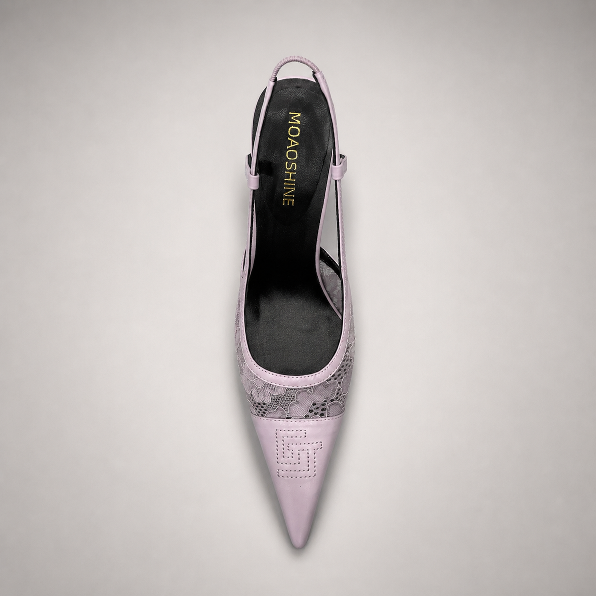 Pink slingback pump rear view showing a pointed toe and lace-panel upper