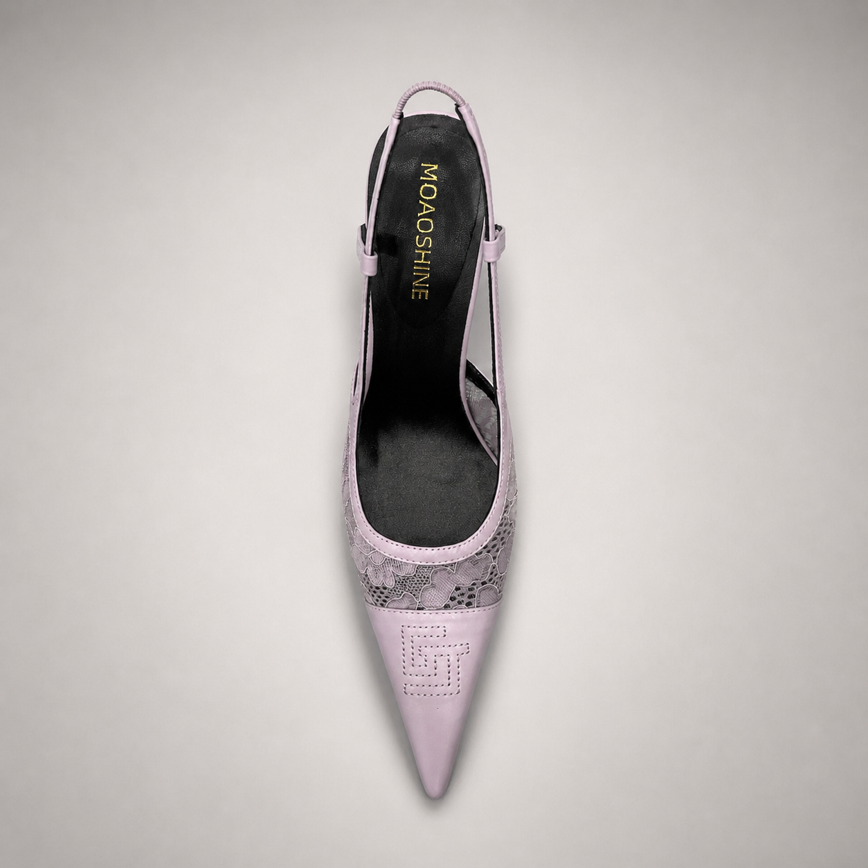 Pink slingback pump rear view showing a pointed toe and lace-panel upper