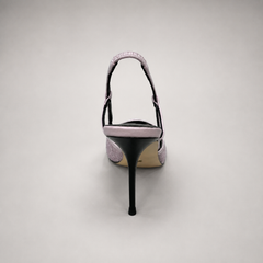 Pink slingback pump top view showing a pointed toe and lace-panel upper