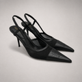 Black slingback pump pair three-quarter view showing a pointed toe and lace-panel upper