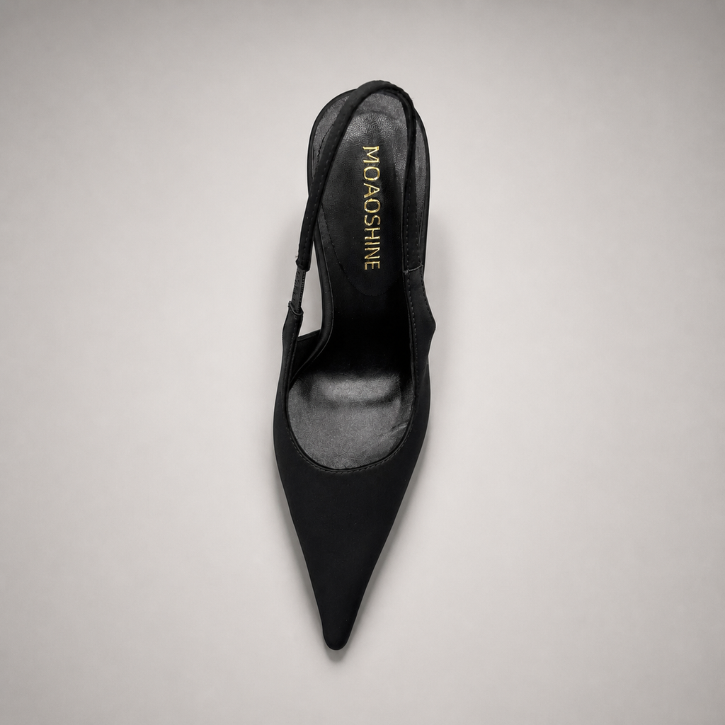 Black slingback pump outsole view showing the cow leather outsole