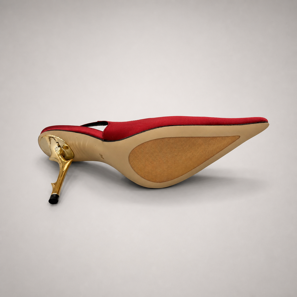 Red slingback pump rear view showing a pointed toe and sculpted heel