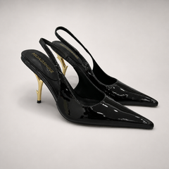 Black slingback pump pair three-quarter view showing a pointed toe and sculpted heel