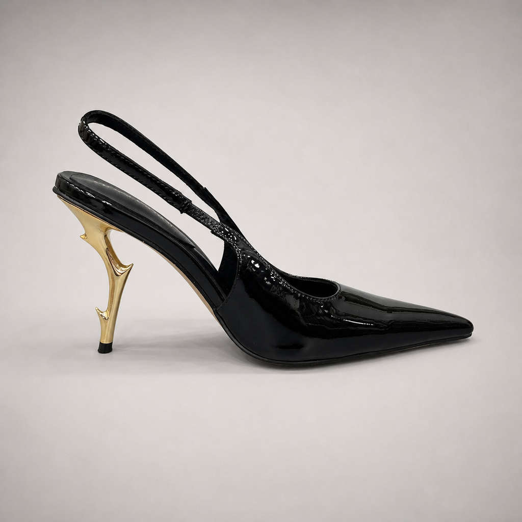 Black slingback pump side profile showing a pointed toe and sculpted heel