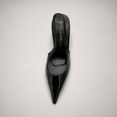 Black slingback pump opposite side profile showing a pointed toe and sculpted heel