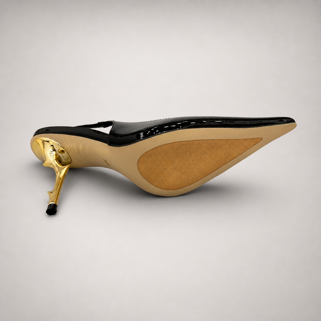 Black slingback pump rear view showing a pointed toe and sculpted heel