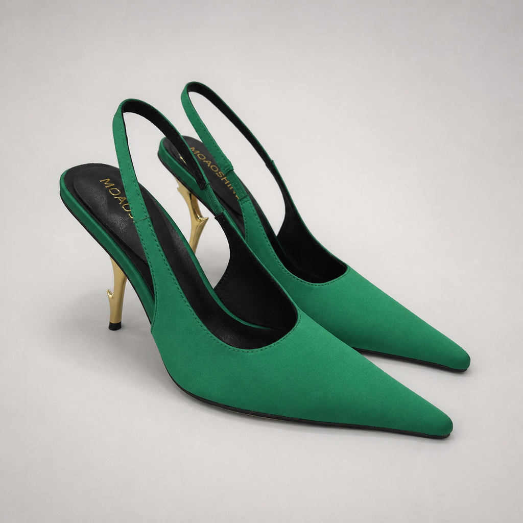Green slingback pump pair three-quarter view showing a pointed toe and sculpted heel