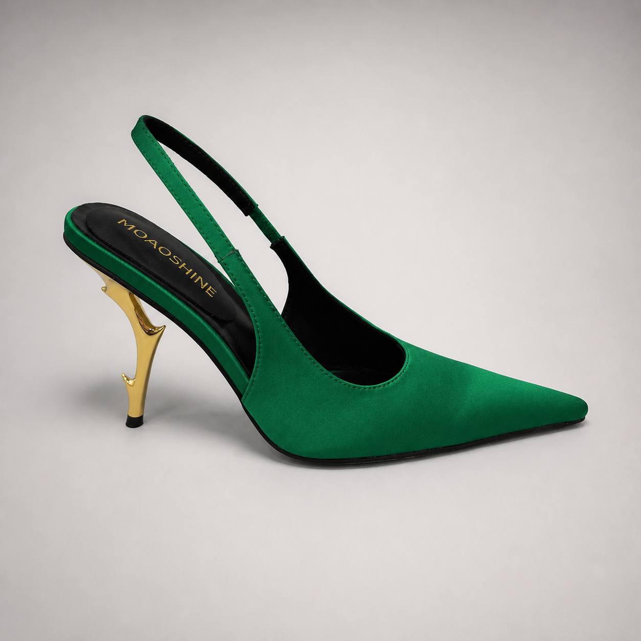 Green slingback pump side profile showing a pointed toe and sculpted heel